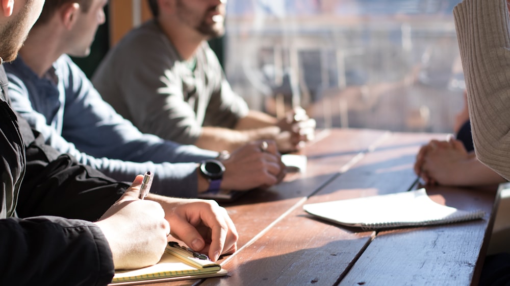 Consultants reviewing documents together in a meeting